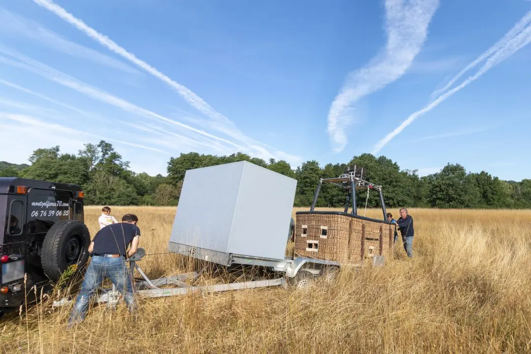 Aerial work platform loaded on its transport trailer